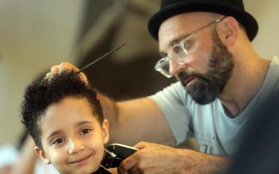 Molendinar boy Izaiah Smith gets his curly locks of hair cut for charity and loves his do